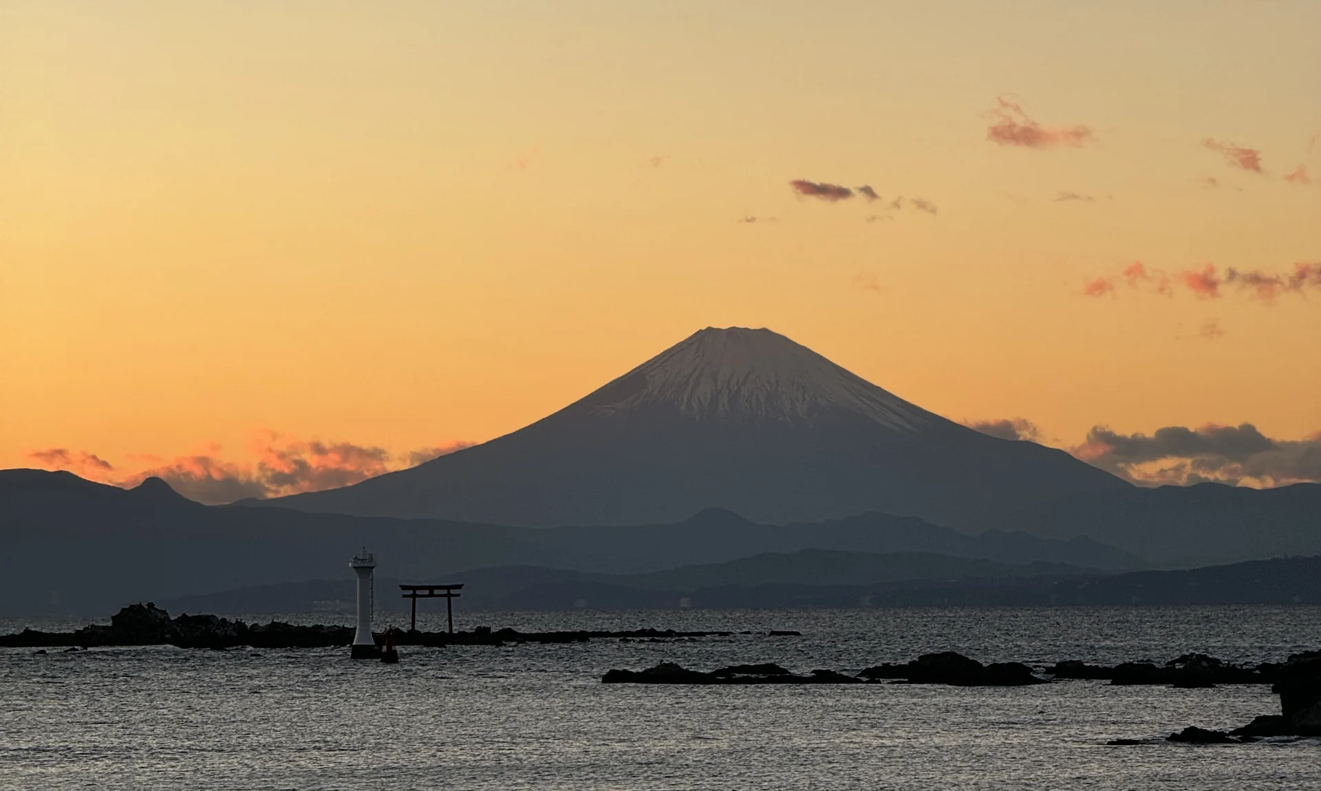 Mount Fuji at dusk over Hayama Bay